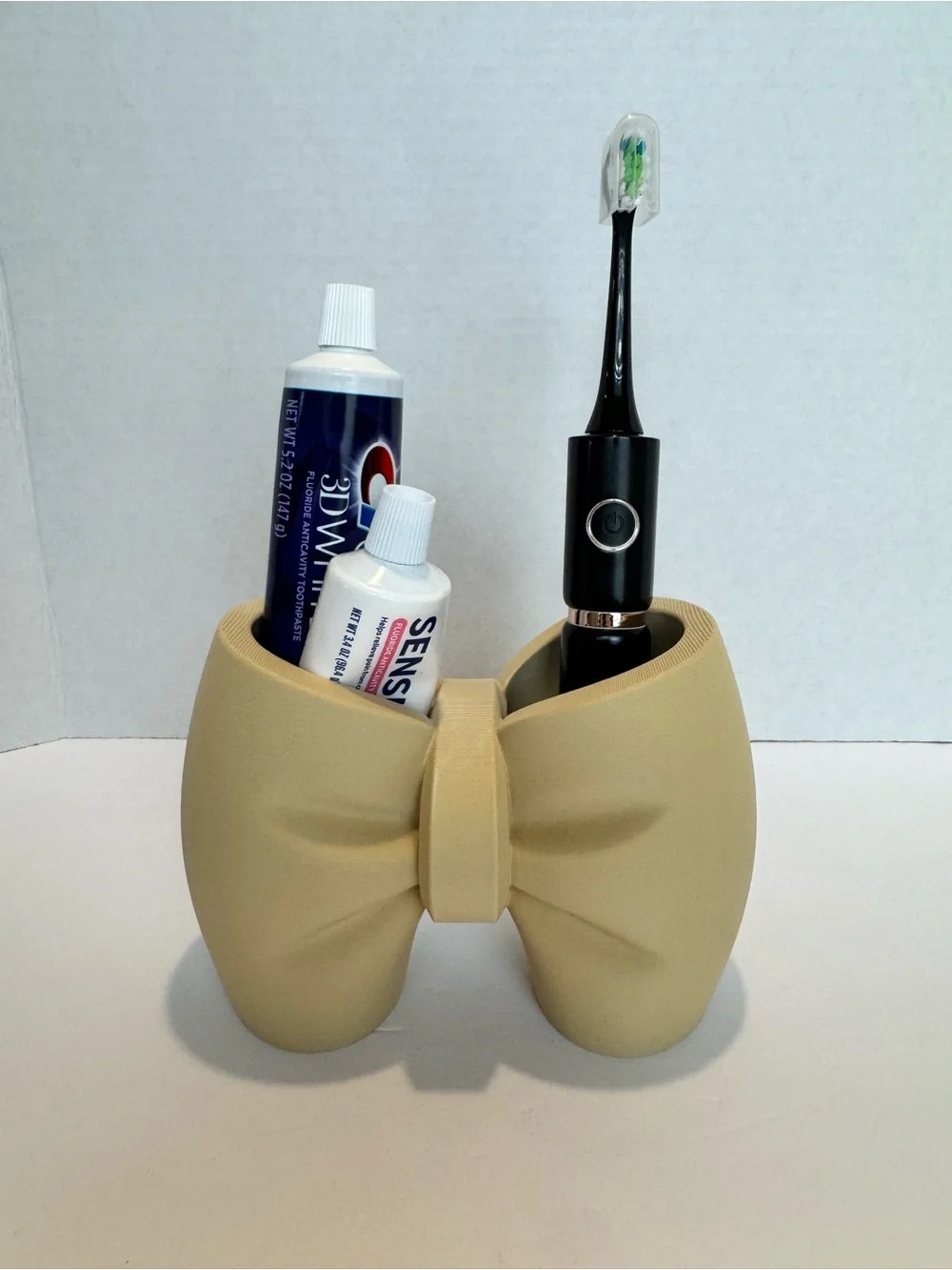 3d printed Bow-Shaped Toothbrush & Toothpaste Holder in Beige